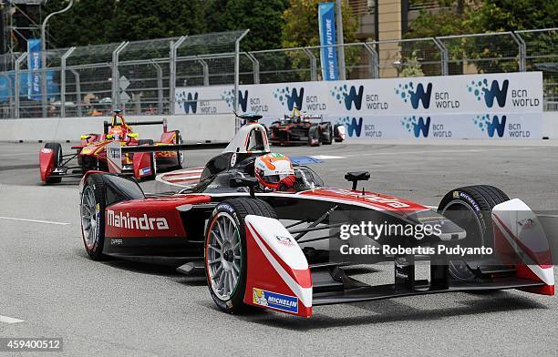 Karun Chandhok of India and Mahindra Racing Formula E Team leads during the FIA Formula E Putrajaya ePrix Championship race on November 22, 2014 in...