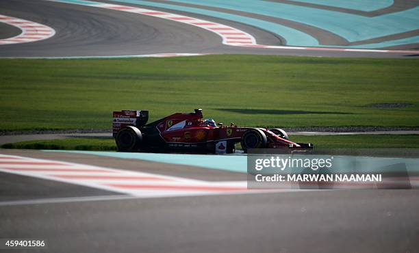 Ferrari's Spanish driver Fernando Alonso drives during the third practice session at the Yas Marina circuit in Abu Dhabi on November 22, 2014 ahead...