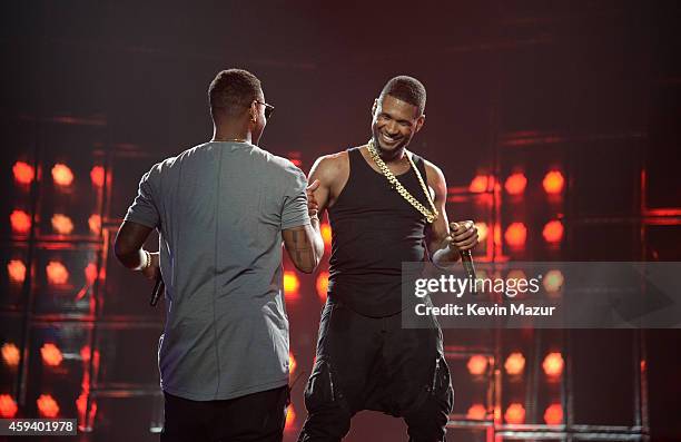 Recording artists Jeremih and Usher perform onstage during "The UR Experience" tour at Staples Center on November 21, 2014 in Los Angeles, California.