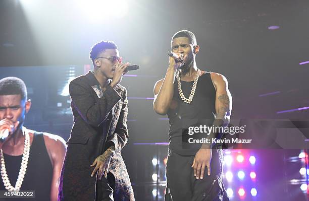 Recording artists August Alsina and Usher perform onstage during "The UR Experience" tour at Staples Center on November 21, 2014 in Los Angeles,...