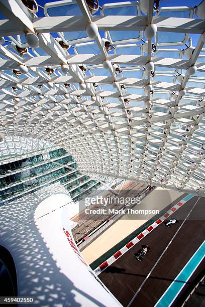 Esteban Gutierrez of Mexico and Sauber F1 and Felipe Massa of Brazil and Williams drive during final practice ahead of the Abu Dhabi Formula One...