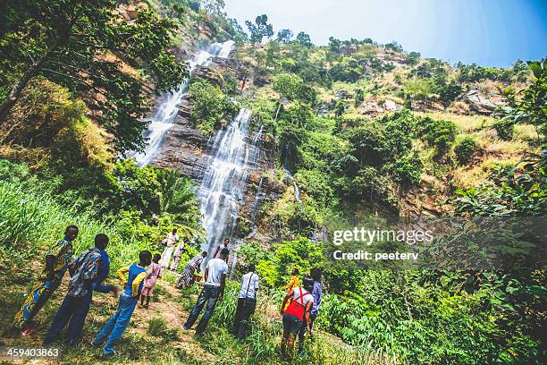 people visiting kpalime waterfalls. - togo stock pictures, royalty-free photos & images