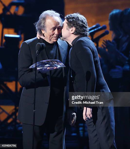 Person of the Year honoree Joan Manuel Serrat and recording artist Joaquin Sabina speak onstage during the 15th Annual Latin GRAMMY Awards held at...