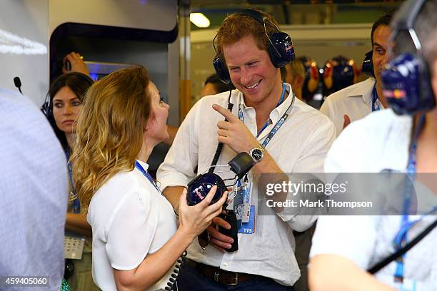 Prince Harry speaks with Geri Halliwell in the Infiniti Red Bull Racing garage during qualifying for the Abu Dhabi Formula One Grand Prix at Yas...