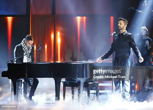 Mario Domm of music group Camila and Ricky Martin perform onstage during the 15th Annual Latin GRAMMY Awards held at the MGM Grand Arena on November...