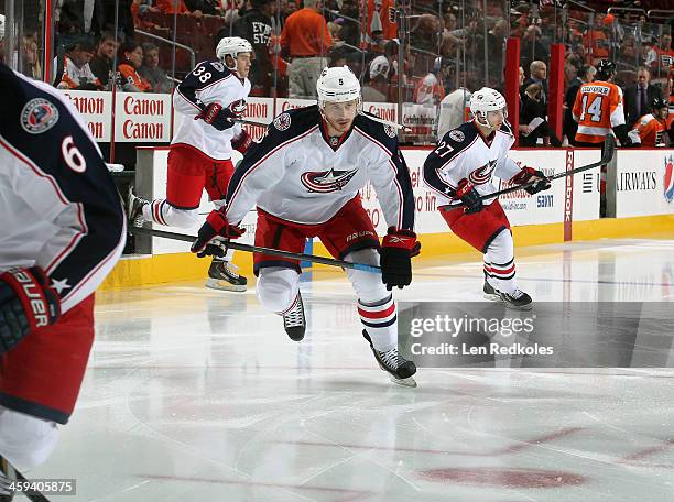 Jack Skille, Ryan Murray and Boone Jenner of the Columbus Blue Jackets skate onto the ice at the start of their game against the Philadelphia Flyers...