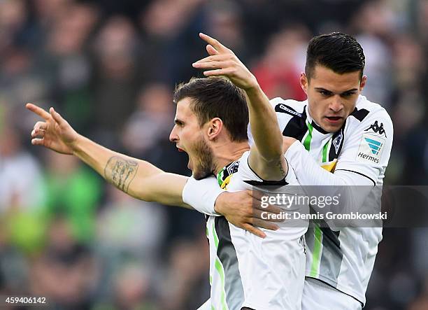 Havard Nordtveit of Borussia Moenchengladbach celebrates with team mate Granit Xhaka as he scores their first goal during the Bundesliga match...
