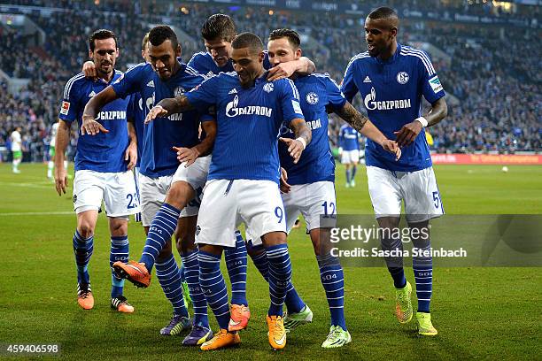 Eric Maxim Choupo-Moting of Schalke celebrates with team mates after scoring his team's second goal during the Bundesliga match between FC Schalke 04...