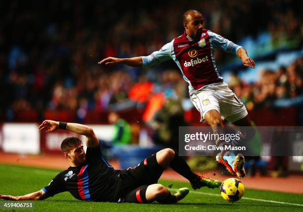 Joel Ward of Crystal Palace tackles Fabian Delph of Aston Villa during the Barclays Premier League match between Aston Villa and Crystal Palace at...