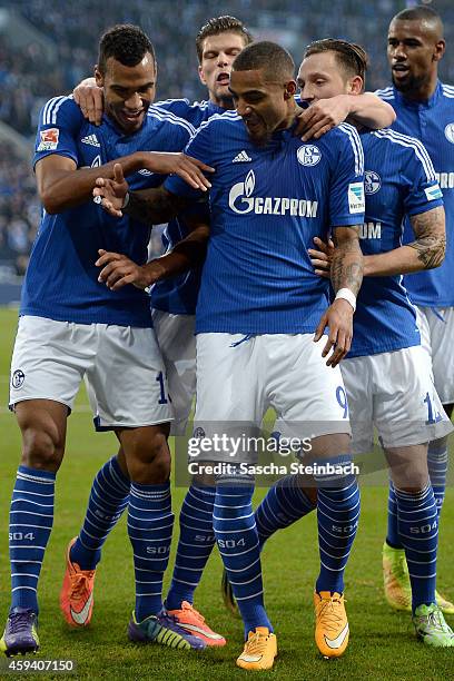 Eric Maxim Choupo-Moting of Schalke celebrates with team mates after scoring his team's second goal during the Bundesliga match between FC Schalke 04...