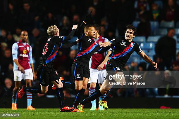 Dwight Gayle of Crystal Palace celebrates with team mates after scoring the winning goal during the Barclays Premier League match between Aston Villa...