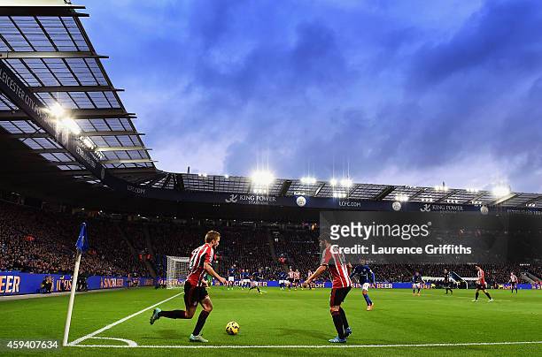 Seb Larsson of Sunderland takes a short corner with Jordi Gomez of Sunderland during the Barclays Premier League match between Leicester City and...