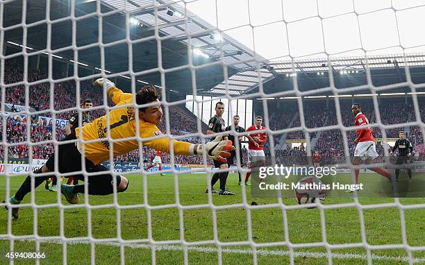 Junior Diaz of Mainz scores his team's first goal past goalkeeper Roman Buerki of Freiburg during the Bundesliga match between FSV Mainz 05 and SC...