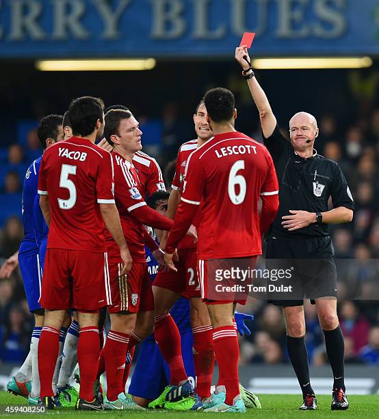Referee Lee Mason shows Claudio Yacob of West Brom a red card during the Barclays Premier League match between Chelsea and West Bromwich Albion at...