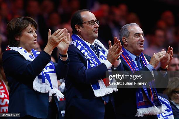 French president, Francois Hollande and Martine Aubry watch play during day two of the Davis Cup Tennis Final between France and Switzerland at the...