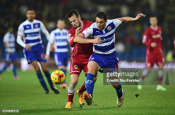 Cardiff player Adam Le Fondre challenges Stephen Kelly of Reading during the Sky Bet Championship match between Cardiff City and Reading at Cardiff...