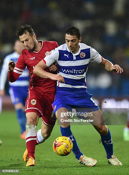 Cardiff player Adam Le Fondre challenges Stephen Kelly of Reading during the Sky Bet Championship match between Cardiff City and Reading at Cardiff...