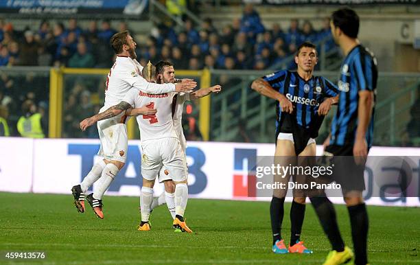 Radja Nainggolan of AS Roma is mobbed by team mates after scoring his team's second goal during the Serie A match between Atalanta BC and AS Roma at...