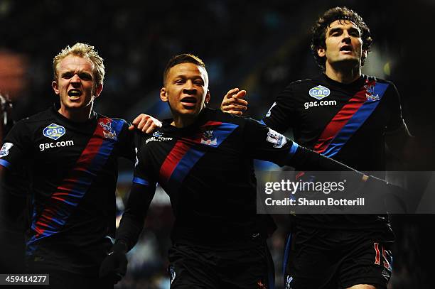 Dwight Gayle of Crystal Palace celebrates with team mates after scoring his sides winning goal during the Barclays Premier League match between Aston...