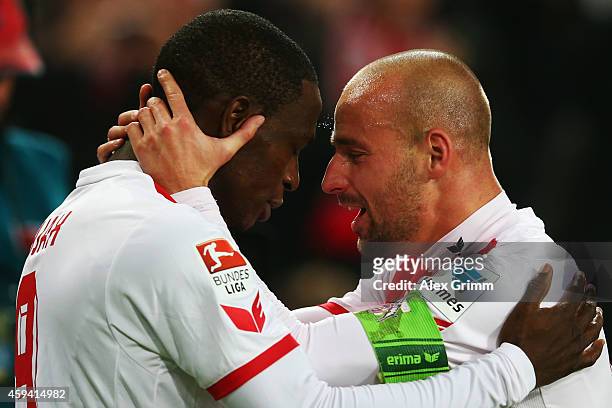 Anthony Ujah of Koeln celebrates his team's first goal with team mate Miso Brecko during the Bundesliga match between 1. FC Koeln and Hertha BSC at...