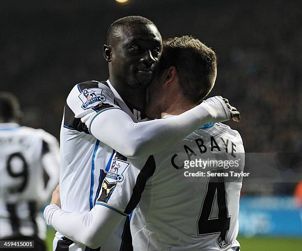 Papiss Cisse celebrates with Yohan Cabaye after scoring their fifth goal during the Barclays Premier League match between Newcastle United and Stoke...