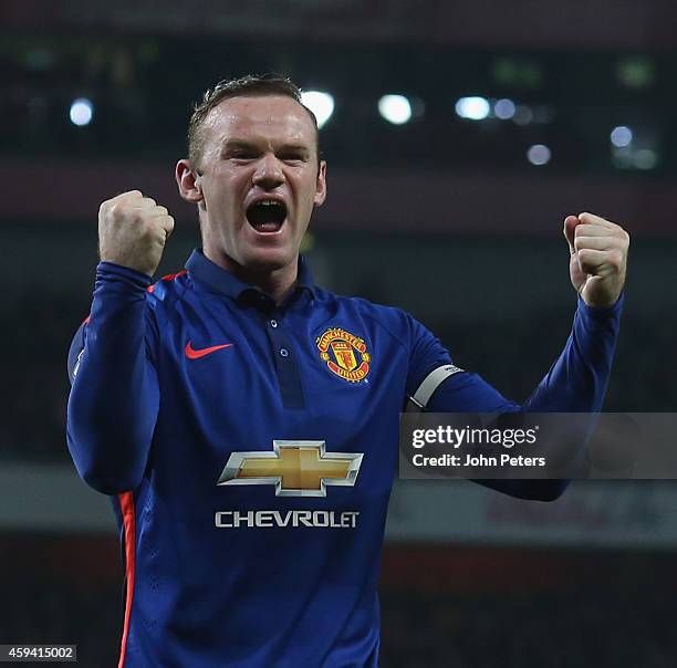 Wayne Rooney of Manchester United celebrates Kieran Gibbs of Arsenal scoring an own-goal during the Barclays Premier League match between Arsenal and...