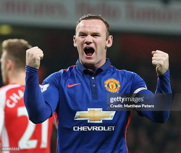 Wayne Rooney of Manchester United celebrates Kieran Gibbs of Arsenal scoring an own-goal during the Barclays Premier League match between Arsenal and...