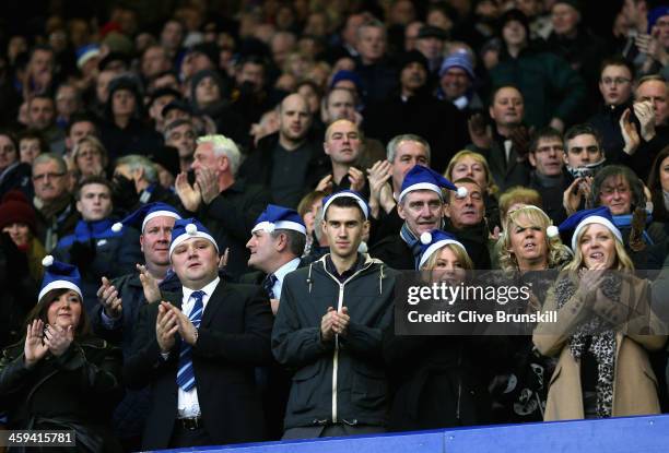 Everton fans in christmas hats during the Barclays Premier League match between Everton and Sunderland at Goodison Park on December 26, 2013 in...
