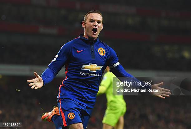 Wayne Rooney of Manchester United celebrates scoring his team's second goal during the Barclays Premier League match between Arsenal and Manchester...