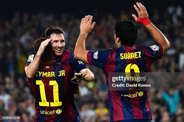 Lionel Messi of FC Barcelona celebrates with his teammates Neymar and Luis Suarez of FC Barcelona after scoring his team's fourth goal during the La...