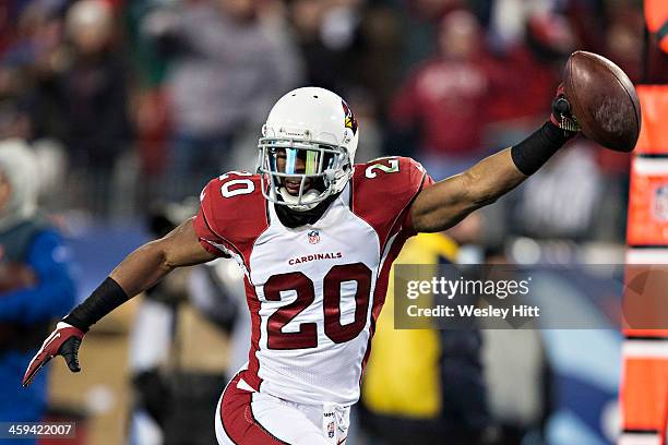 Antoine Cason of the Arizona Cardinals scores a touchdown after intercepting a pass against the Tennessee Titans at LP Field on December 15, 2013 in...
