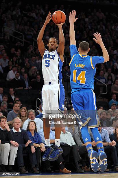 Rodney Hood of the Duke Blue Devils puts up a shot against the UCLA Bruins during the CARQUEST Auto Parts Classic at Madison Square Garden on...