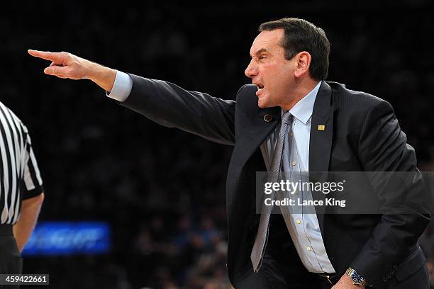 Head Coach Mike Krzyzewski of the Duke Blue Devils directs his team against the UCLA Bruins during the CARQUEST Auto Parts Classic at Madison Square...