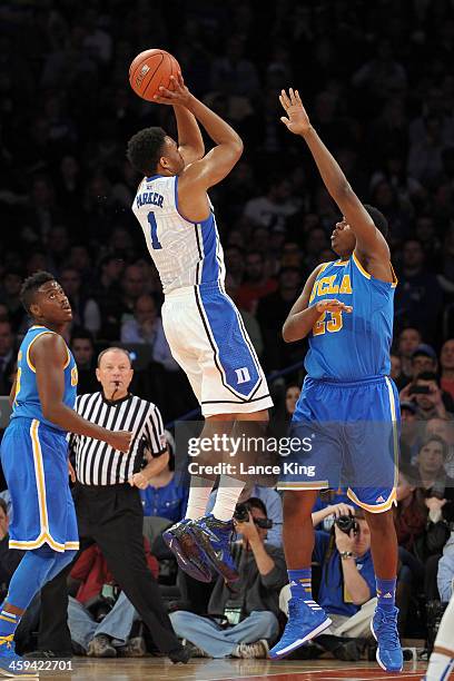 Jabari Parker of the Duke Blue Devils puts up a shot against Tony Parker of the UCLA Bruins during the CARQUEST Auto Parts Classic at Madison Square...