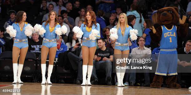 The mascot and cheerleaders of the UCLA Bruins perform against the Duke Blue Devils during the CARQUEST Auto Parts Classic at Madison Square Garden...