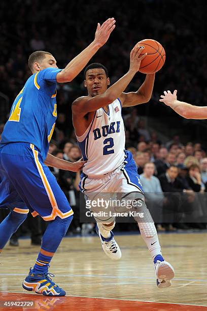 Quinn Cook of the Duke Blue Devils drives against the UCLA Bruins during the CARQUEST Auto Parts Classic at Madison Square Garden on December 19,...