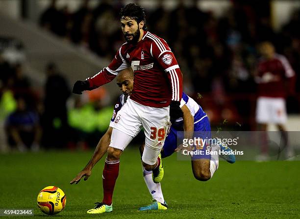 Djamal Abdoun of Nottingham Forest advances under pressure from Karl Henry of QPR during the Sky Bet Championship match between Nottingham Forest and...