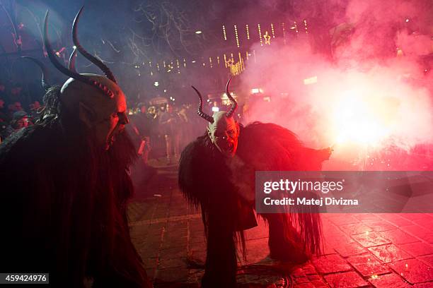 Participants dressed as the Krampus creatures walk the streets during Krampus gathering on November 22, 2014 in Schladming, Austria. Krampus is a...
