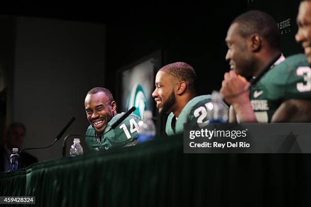 Tony Lippett, Kurtis Drummond, Taiwan Jones of the Michigan State Spartans during a press conference after defeating Rutgers Scarlet Knights at...