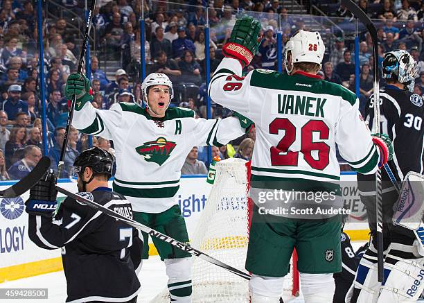 Zach Parise the Minnesota Wild celebrates his goal with teammate Thomas Vanek during the second period against Radko Gudas and goalie Ben Bishop at...