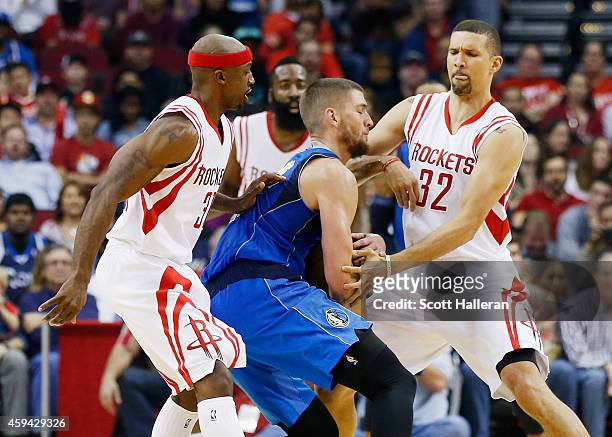 Jason Terry and Francisco Garcia of the Houston Rockets defend against Chandler Parsons of the Dallas Mavericks during their game at the Toyota...