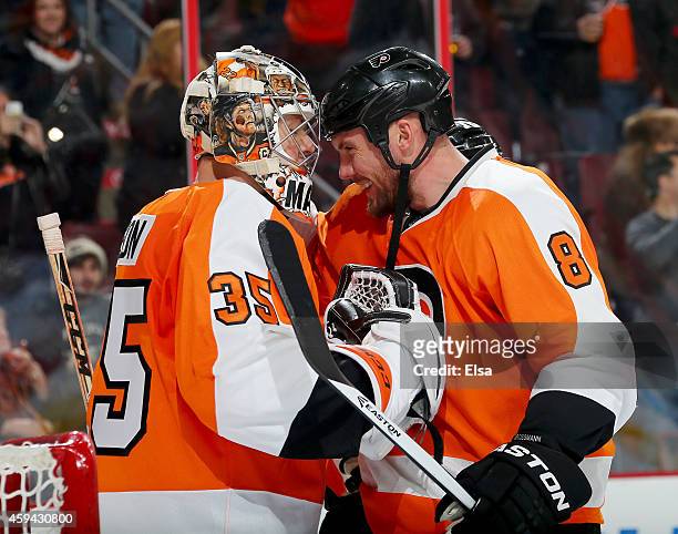 Steve Mason is congratulated by teammate Nicklas Grossmann of the Philadelphia Flyers after the win over the Columbus Blue Jackets on November 22,...