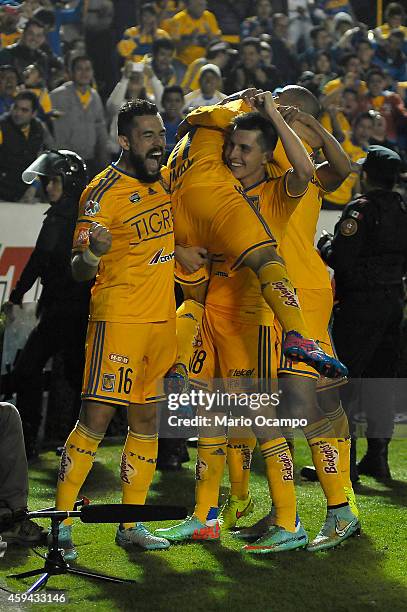 Damian Alvarez of Tigres celebrates with teammates after scoring the winning goal during a match between Tigres UANL and Toluca as part of 17th round...