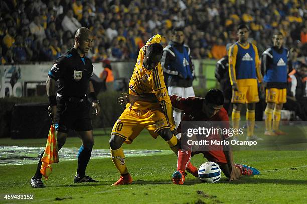 Hernan Burbano of Tigres fights for the ball with Francisco Gamboa of Toluca during a match between Tigres UANL and Toluca as part of 17th round...