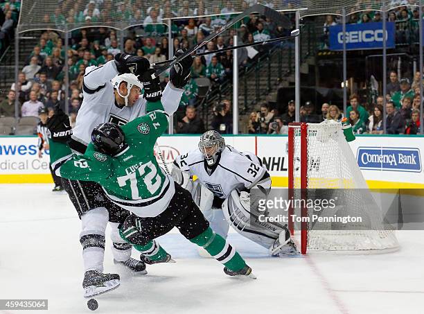 Robyn Regehr of the Los Angeles Kings checks Erik Cole of the Dallas Stars in the third period at American Airlines Center on November 22, 2014 in...