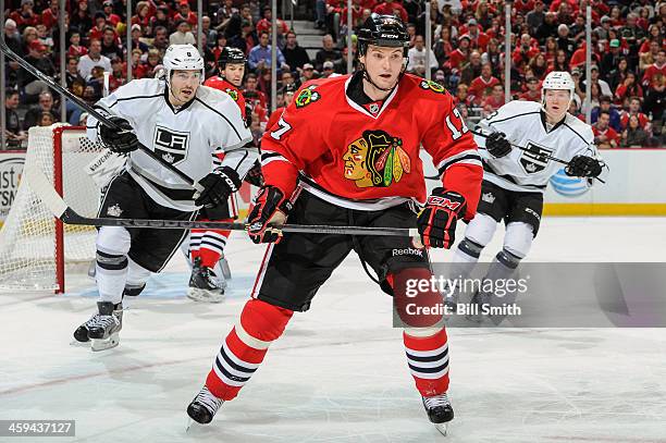 Sheldon Brookbank of the Chicago Blackhawks watches for the puck as Drew Doughty of the Los Angeles Kings skates up from behind during the NHL game...