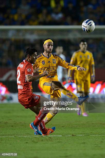 Edgar Lugo of Tigres fights for the ball with Francisco Gamboa of Toluca during a match between Tigres UANL and Toluca as part of 17th round Apertura...