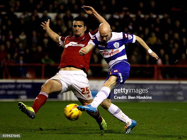 Andy Johnson of QPR shoots on goal ahead of Jack Hobbs of Nottingham Forest during the Sky Bet Championship match between Nottingham Forest and...