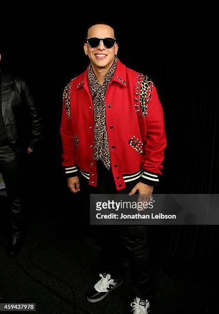 Singer-songwriter Daddy Yankee poses backstage during the iHeartRadio Fiesta Latina festival presented by Sprint at The Forum on November 22, 2014 in...