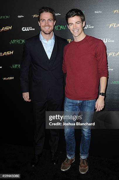 Stephen Amell and Grant Gustin arrive at a special screening for the CW's "Arrow" And "The Flash" at Crest Theatre on November 22, 2014 in Westwood,...